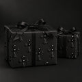Black Gothic Cross Wrapping Paper by The Paper Edit, wrapped gift boxes