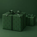 Green Embossed Trees Holiday Wrapping Paper by The Paper Edit, wrapped gift boxes