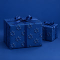 Blue Star of David Hanukkah Wrapping Paper by The Paper Edit, wrapped gift boxes