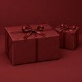 Maroon Bows Holiday Wrapping Paper by The Paper Edit, wrapped gift boxes