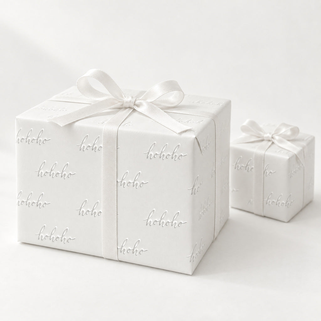 White HO HO HO Holiday Wrapping Paper by The Paper Edit, wrapped gift boxes