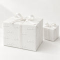 White HO HO HO Holiday Wrapping Paper by The Paper Edit, wrapped gift boxes